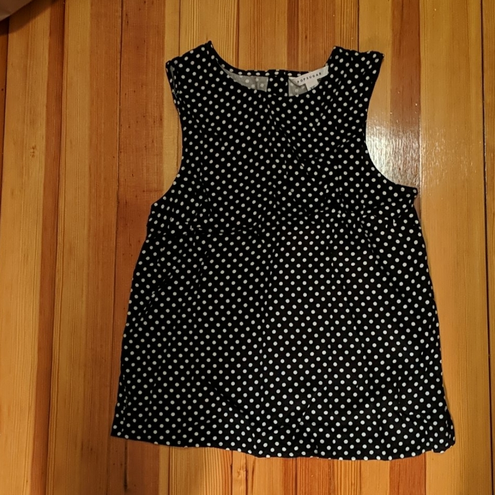 Black/white polka-dot sleeveless blouse